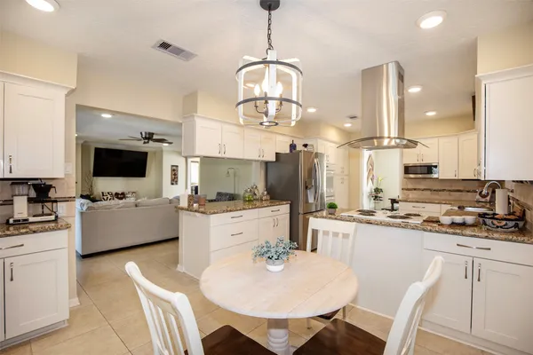 a kitchen with cabinets a sink and a stove