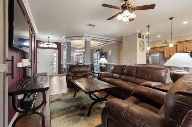 a kitchen with stainless steel appliances granite countertop a refrigerator a sink a stove and oven