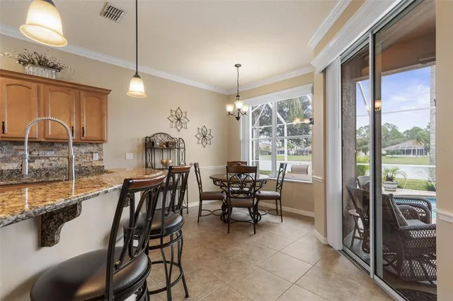 a view of swimming pool with outdoor seating