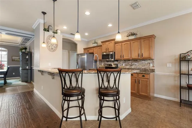 a view of a swimming pool with chairs