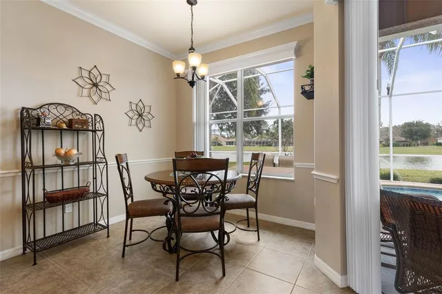 a view of a chair and tables in the balcony
