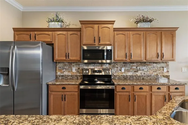 a bedroom with a bed and a dresser with the shoe rack