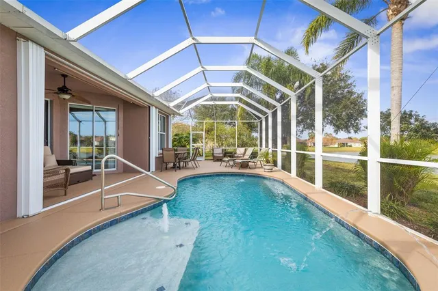 a bedroom with a bed and a window with wooden floor