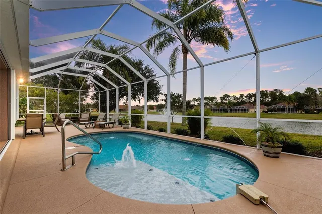 a view of a swimming pool with a patio