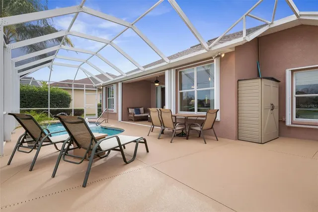 a view of a lake with houses in the back