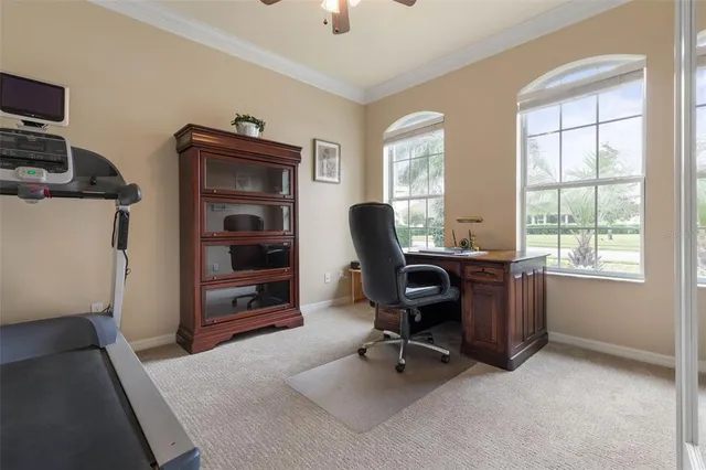an aerial view of residential houses with outdoor space and lake view