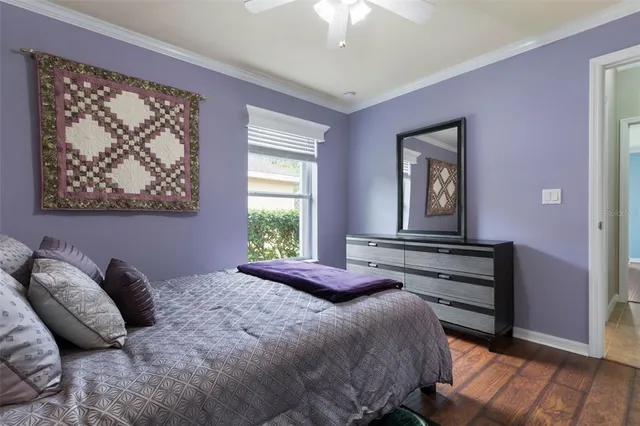 a view of a house with garden and a tree