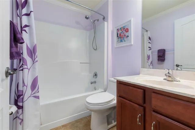 an aerial view of a house with outdoor space and swimming pool