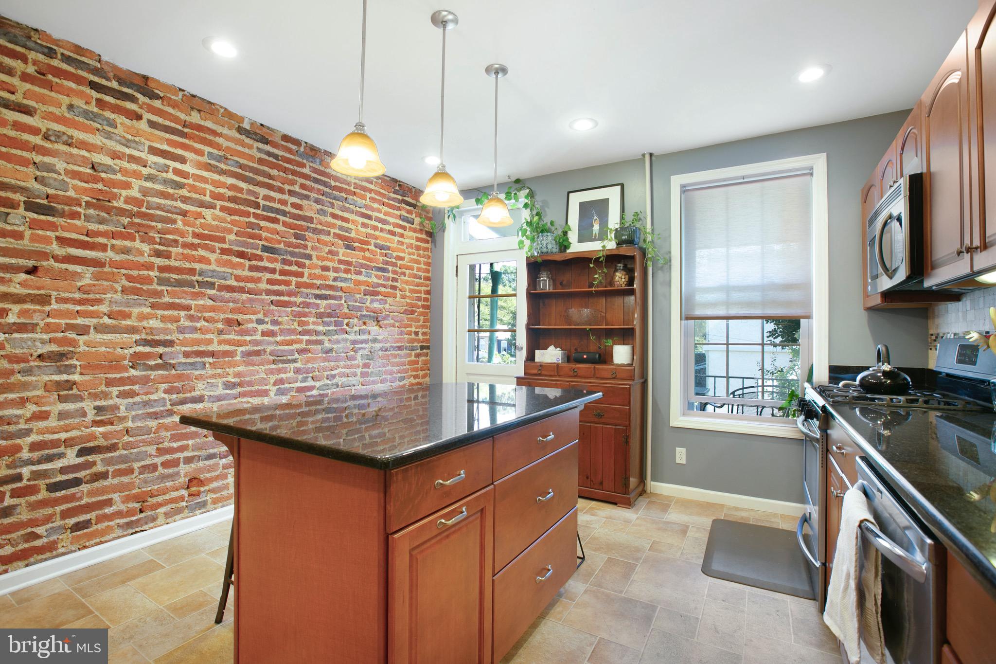 3609 Keswick Road Baltimore, MD 21211 - Photo 12 of 26 Features exposed brick and granite countertops