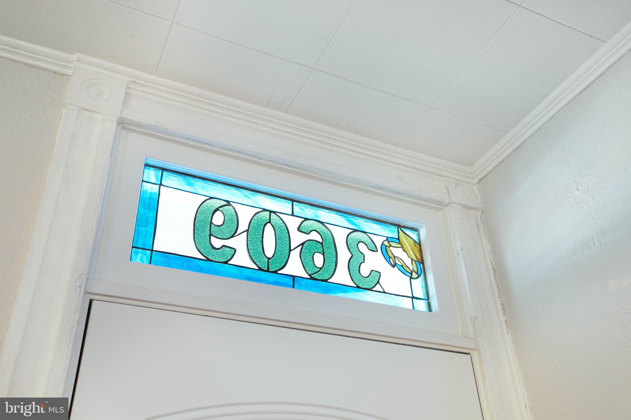 3609 Keswick Road Baltimore, MD 21211 - Photo 10 of 26 Custom stained-glass transom above front door