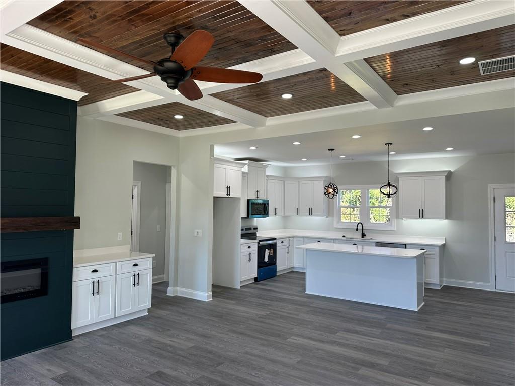 2513 Weldon Drive Augusta, GA 30906 - Photo 16 of 33 a large white kitchen with a large counter top space stainless steel appliances and wooden floor