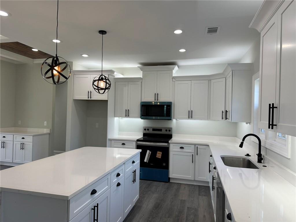 2513 Weldon Drive Augusta, GA 30906 - Photo 18 of 33 a kitchen with a sink stainless steel appliances and white cabinets