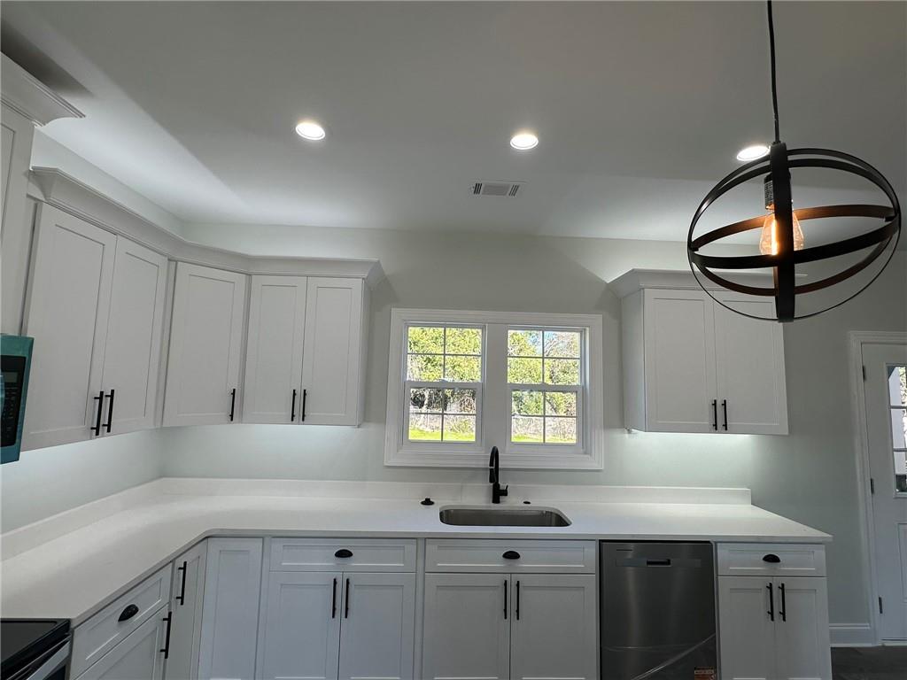 2513 Weldon Drive Augusta, GA 30906 - Photo 20 of 33 a kitchen with stainless steel appliances granite countertop a sink a stove and a wooden floors