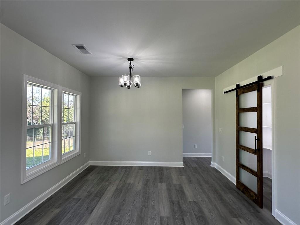 2513 Weldon Drive Augusta, GA 30906 - Photo 22 of 33 wooden floor in an empty room with a window
