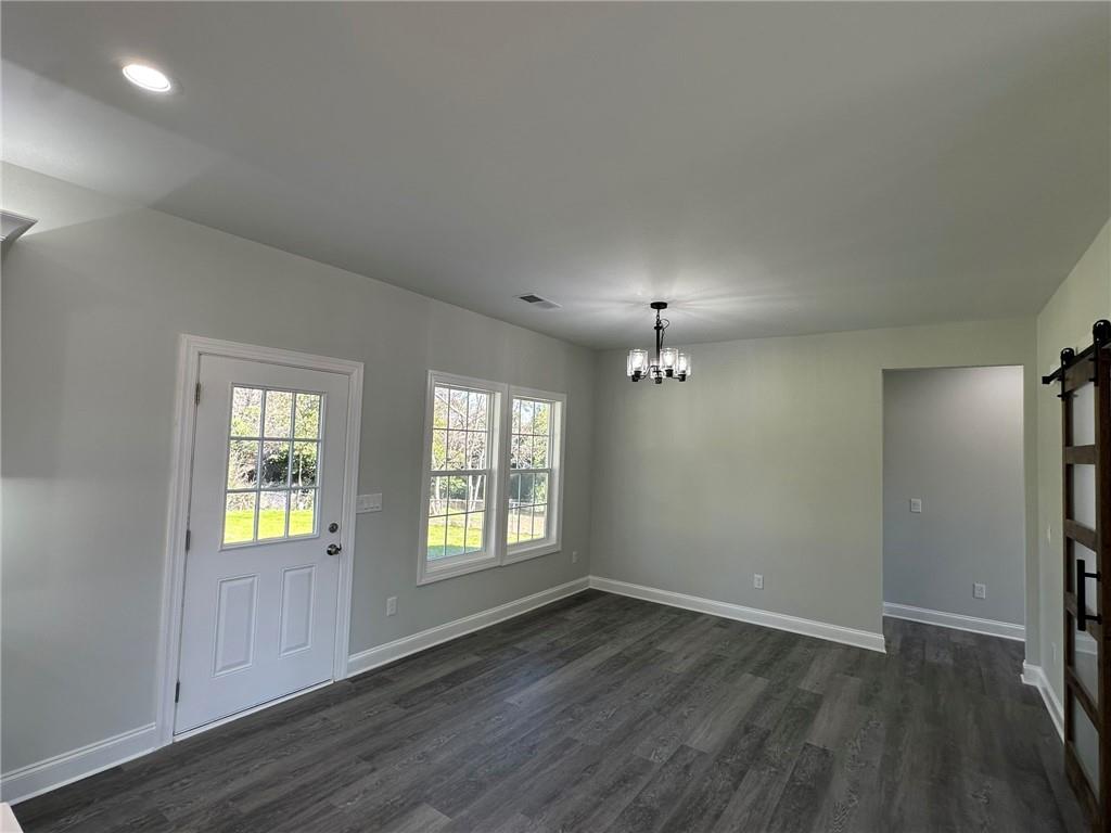 2513 Weldon Drive Augusta, GA 30906 - Photo 23 of 33 an empty room with wooden floor and windows