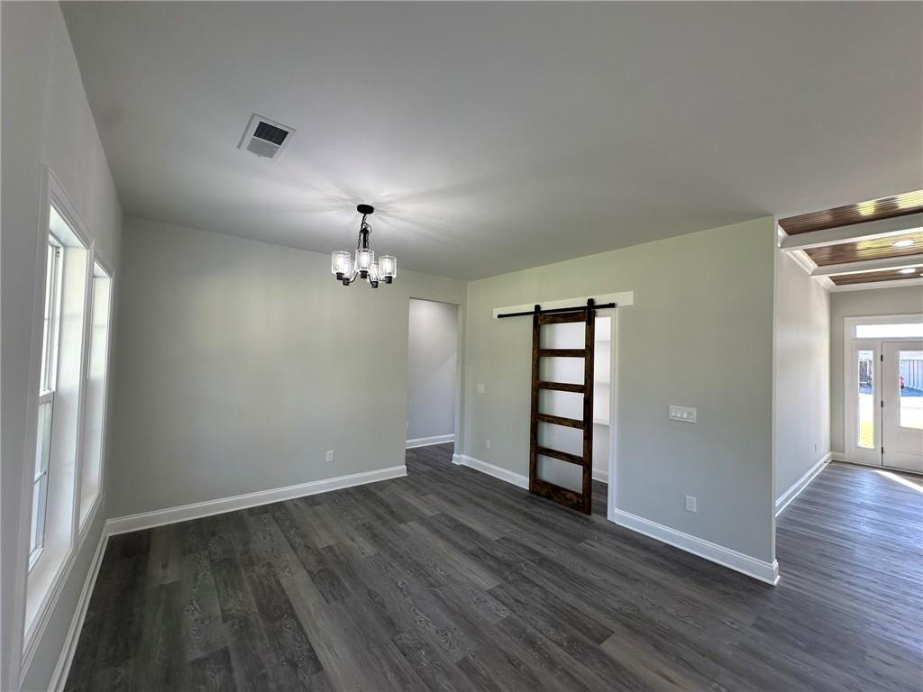 2513 Weldon Drive Augusta, GA 30906 - Photo 24 of 33 wooden floor in an empty room with a window