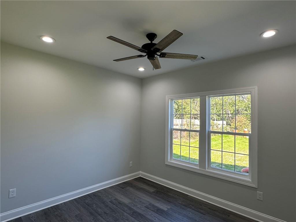 2513 Weldon Drive Augusta, GA 30906 - Photo 30 of 33 an empty room with wooden floor fan and windows