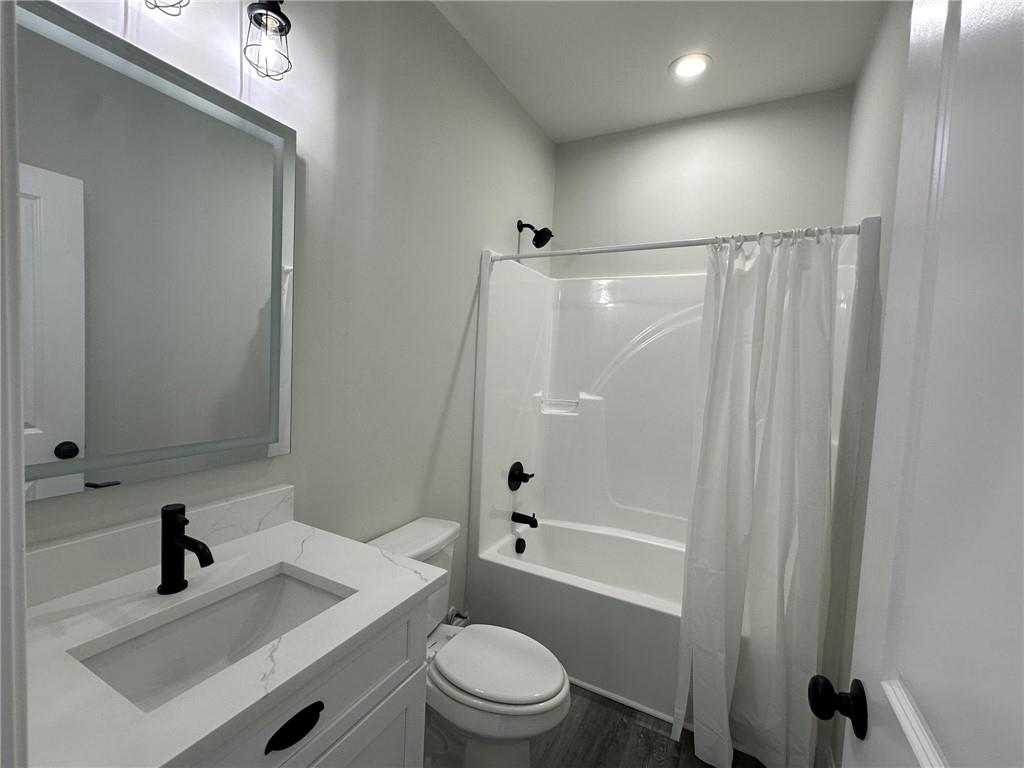 2513 Weldon Drive Augusta, GA 30906 - Photo 31 of 33 a bathroom with a sink a toilet a mirror and shower