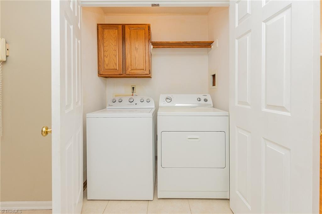 5414 Tower Road Greensboro, NC 27410 - Photo 13 of 45 Laundry next to kitchen