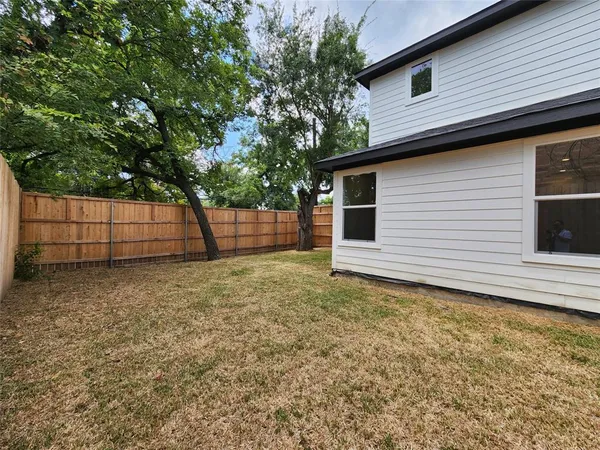a view of a utility room with two washing machine