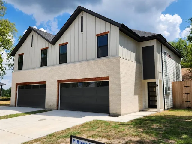 a front view of a house with yard