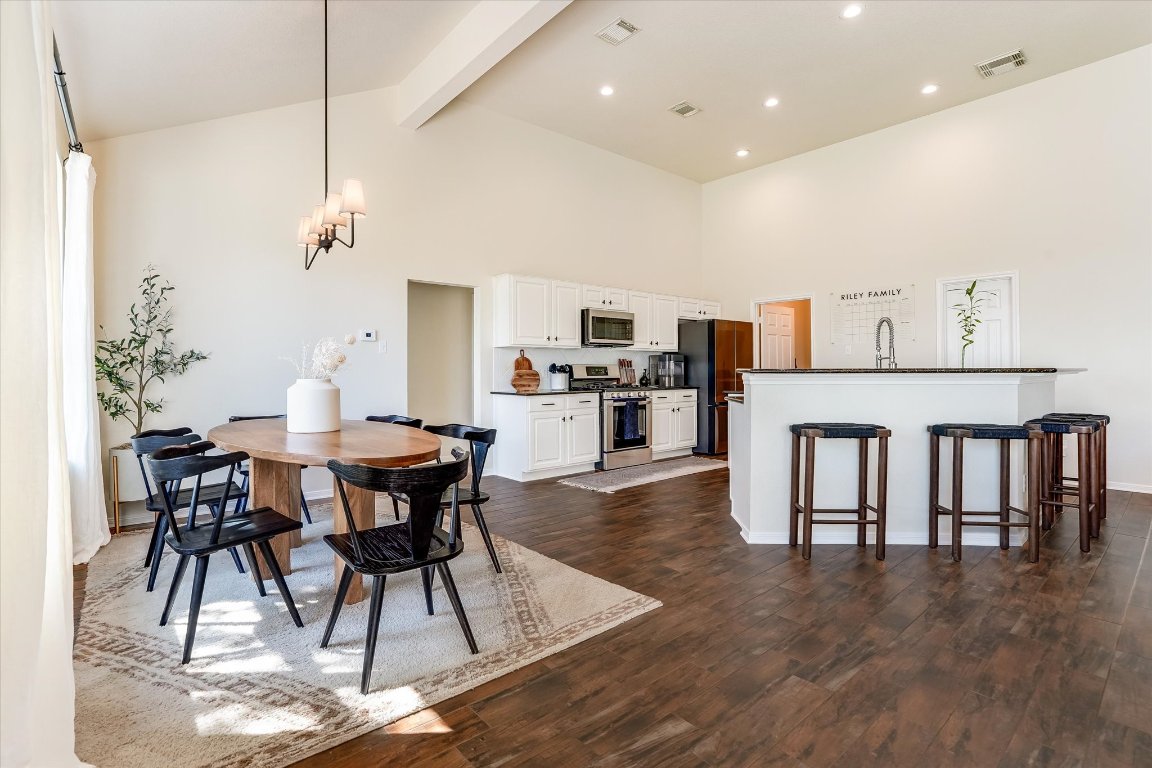 13201 North Ridge Circle Leander, TX 78641 - Photo 13 of 33 a dining room with furniture and wooden floor