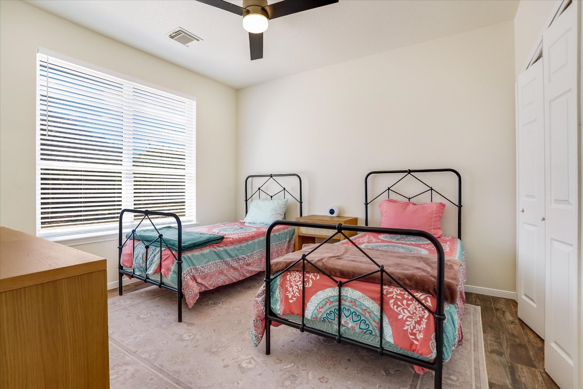 13201 North Ridge Circle Leander, TX 78641 - Photo 25 of 33 a bedroom with two beds and window