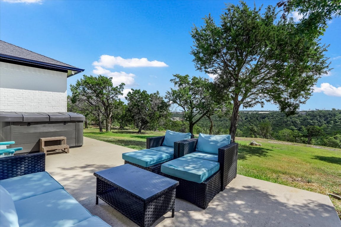 13201 North Ridge Circle Leander, TX 78641 - Photo 27 of 33 a view of a patio with couches and a table and chairs with garden view
