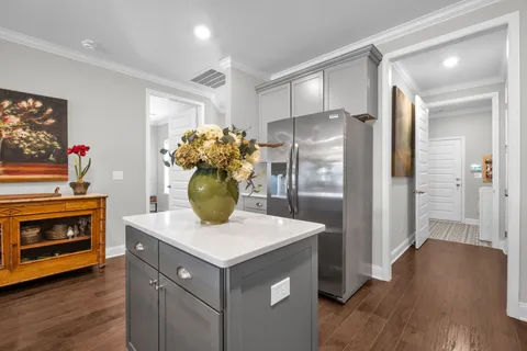a kitchen with stainless steel appliances a refrigerator and a stove