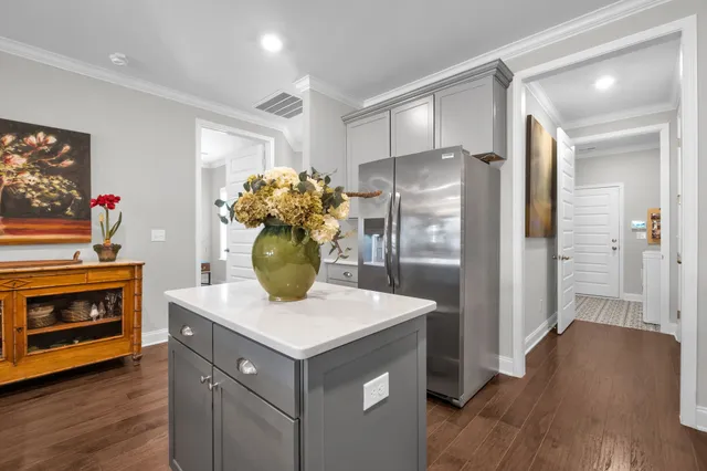 a kitchen with stainless steel appliances a refrigerator and a stove