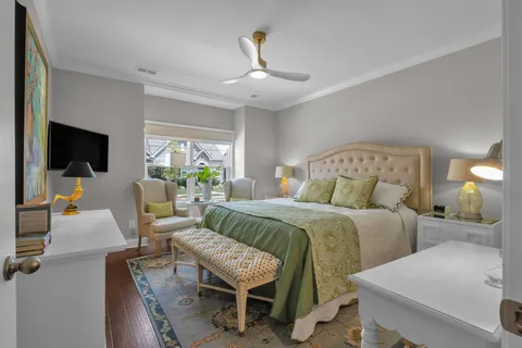 a bed room with bed and a flat screen tv