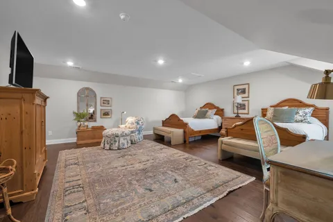 a bed room with bed and mirror