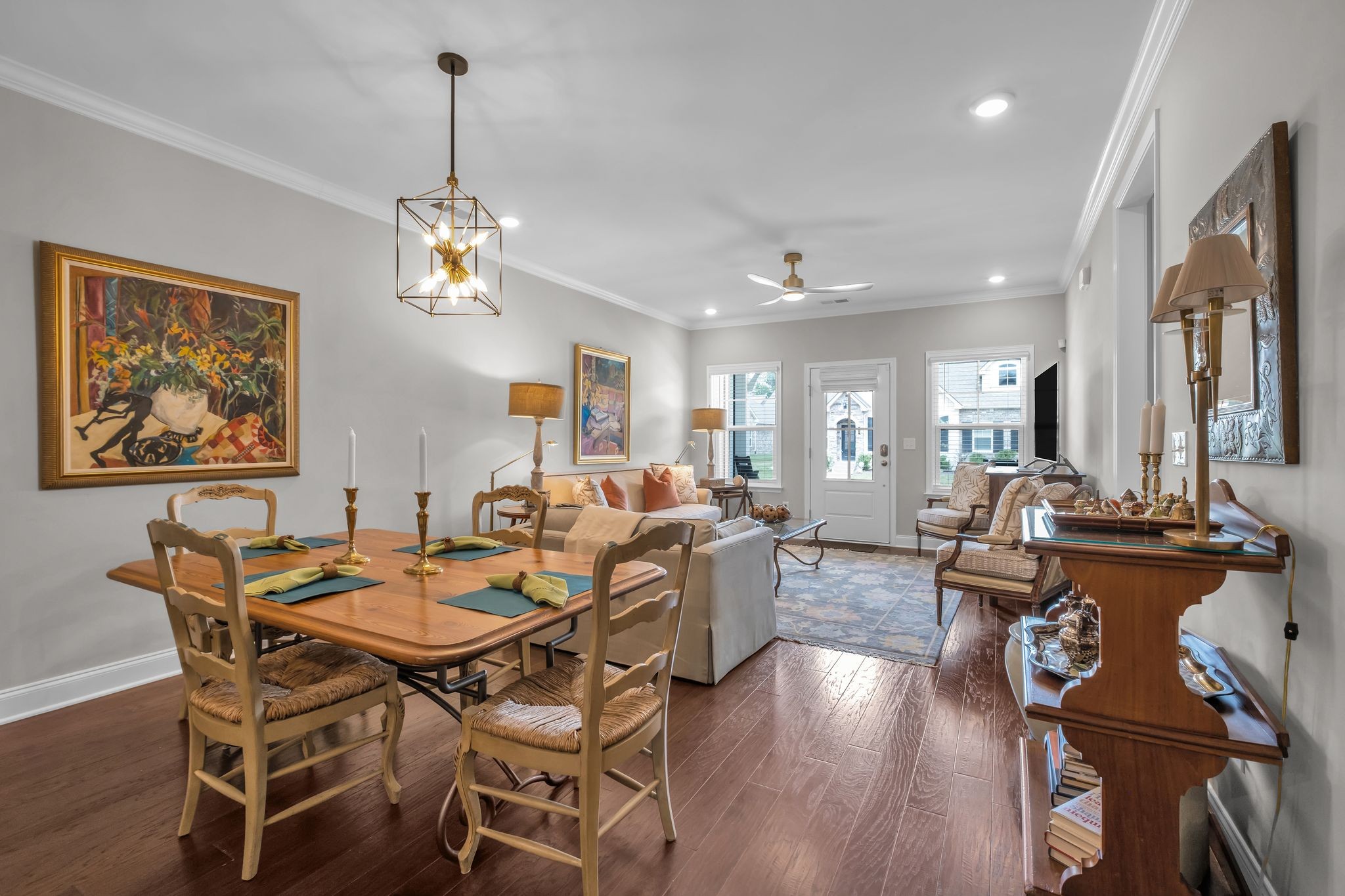 131 Calm Waters Street Franklin, TN 37064 - Photo 9 of 32 a view of a dining room with furniture a chandelier and wooden floor