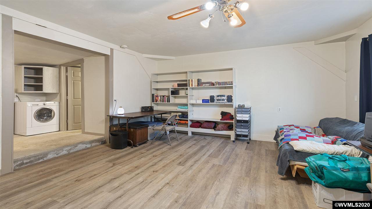 790 Southeast Fir Villa Road Dallas, OR 97338 - Photo 35 of 38 a living room with furniture and a wooden floor