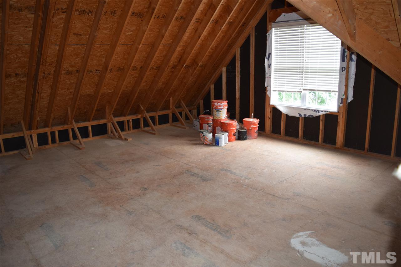 9307 Tabriz Point Raleigh, NC 27614 - Photo 22 of 24 an empty room with windows and chair