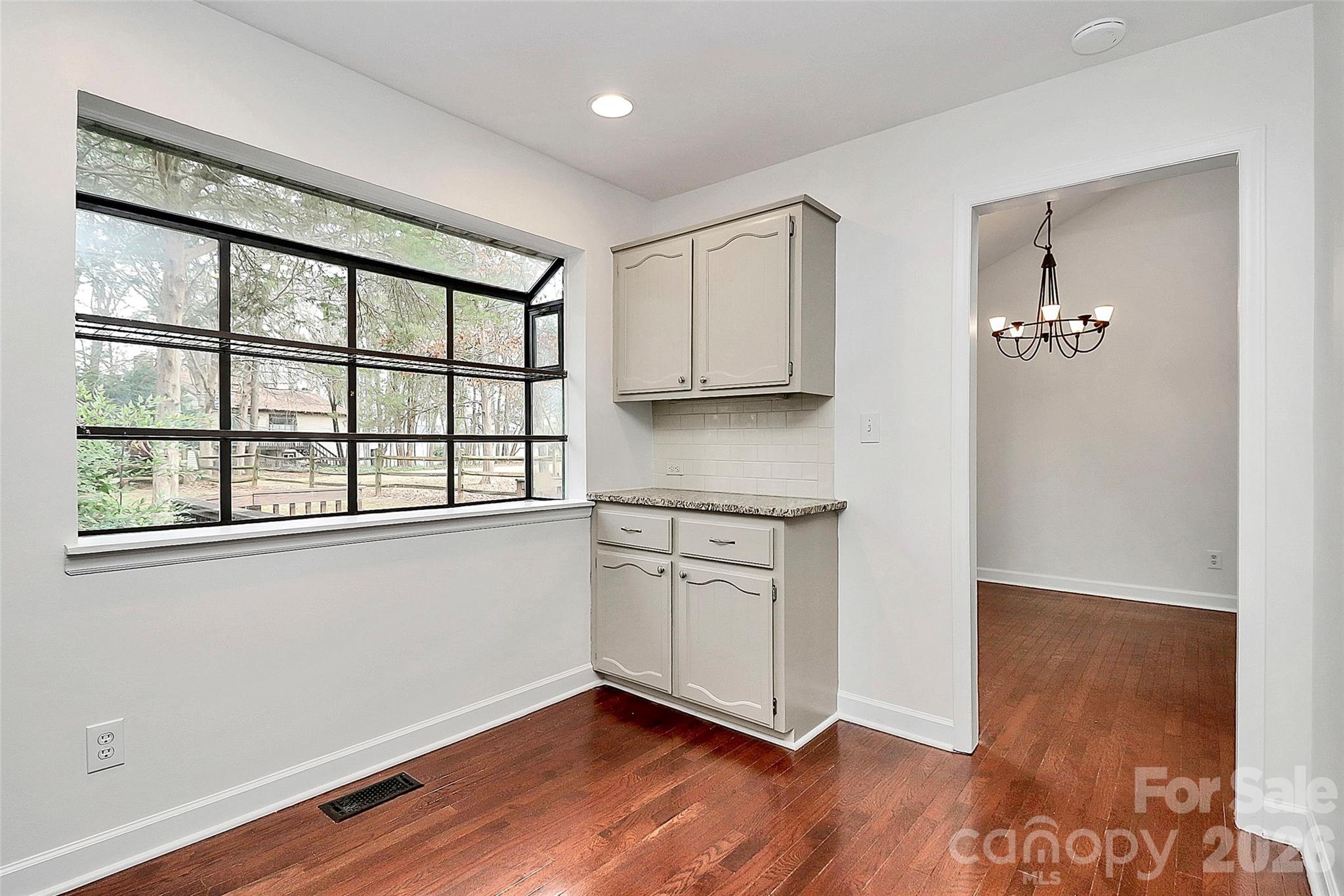 9421 Fairway Ridge Road Charlotte, NC 28277 - Photo 14 of 36 a view of a kitchen with wooden floor and a window