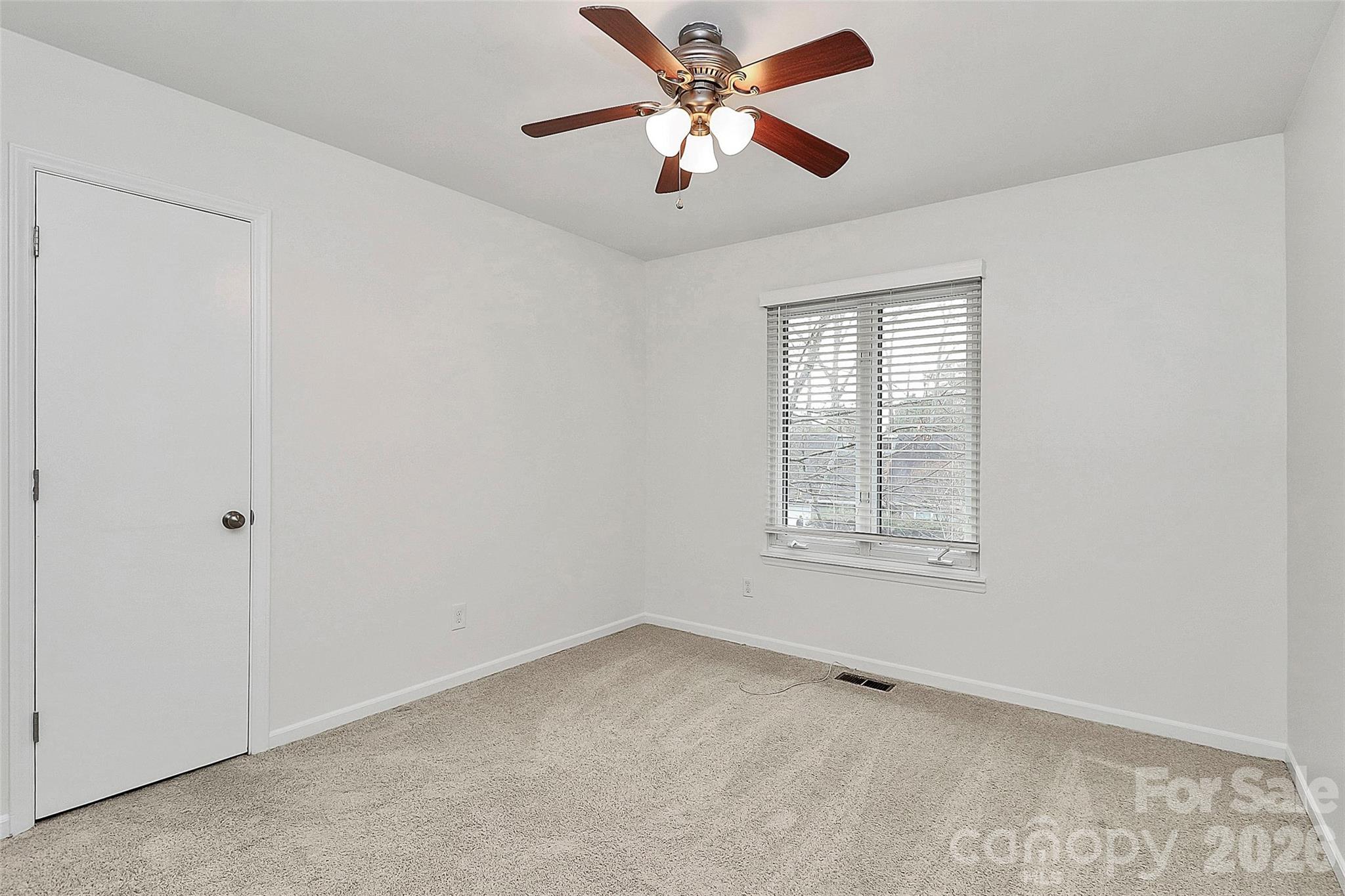 9421 Fairway Ridge Road Charlotte, NC 28277 - Photo 20 of 36 a view of an empty room with a window