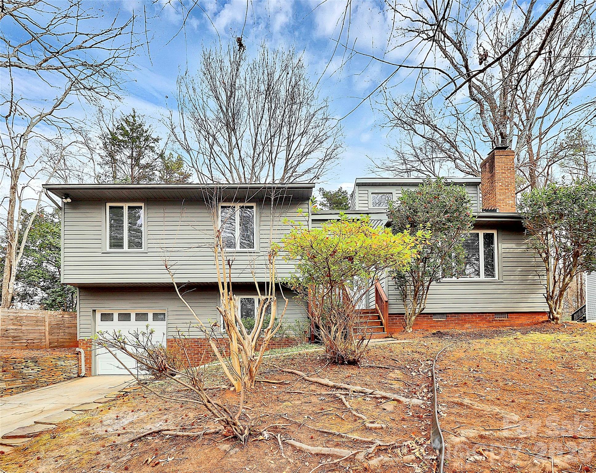 9421 Fairway Ridge Road Charlotte, NC 28277 - Photo 2 of 36 a front view of a house with a yard outdoor seating and barbeque oven