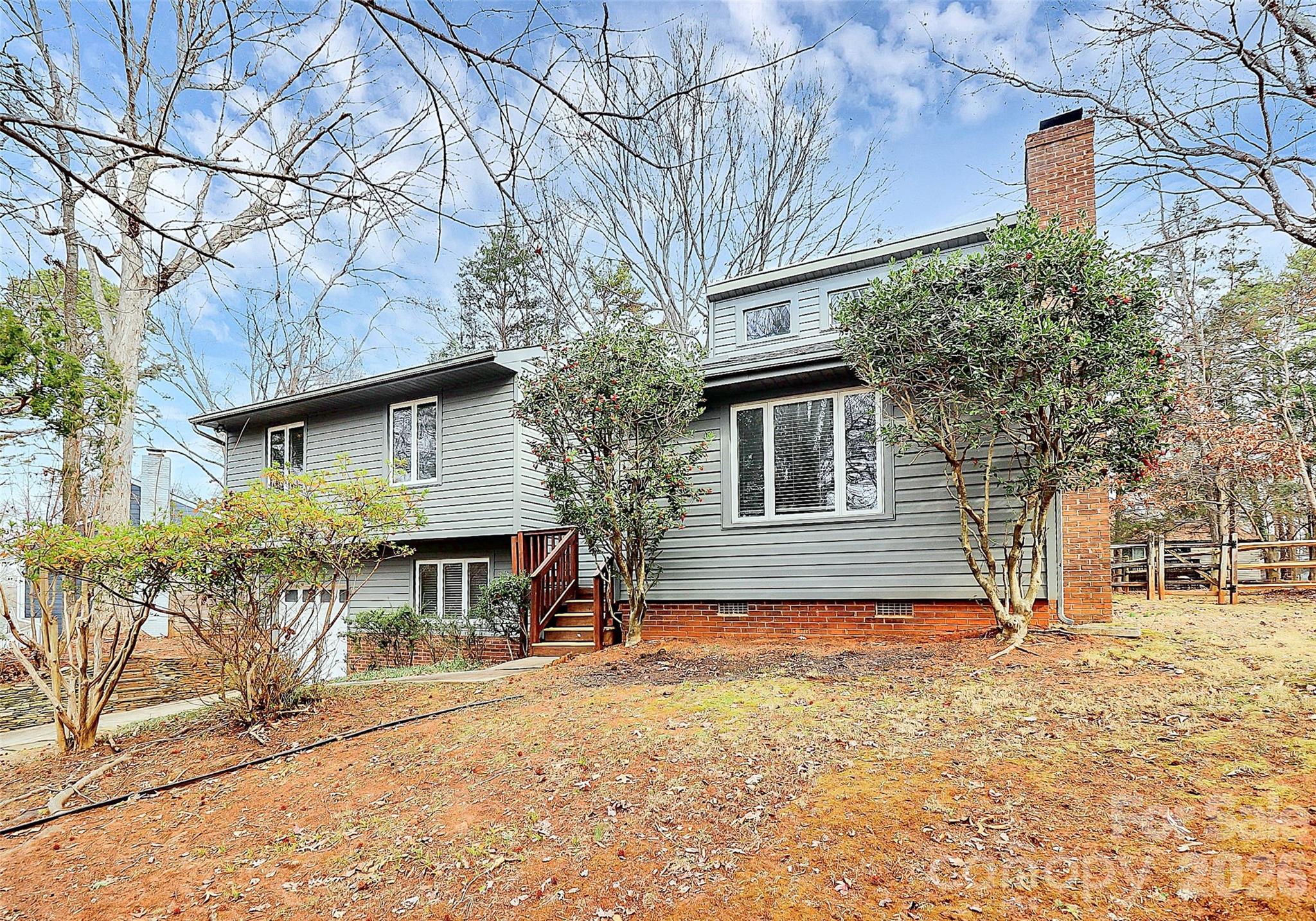 9421 Fairway Ridge Road Charlotte, NC 28277 - Photo 3 of 36 a front view of a house with a yard