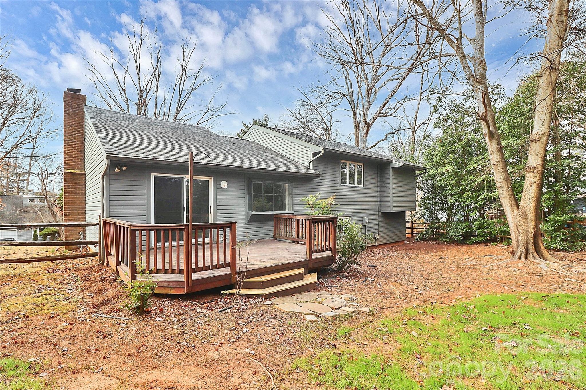 9421 Fairway Ridge Road Charlotte, NC 28277 - Photo 32 of 36 a view of a house with a yard and wooden fence
