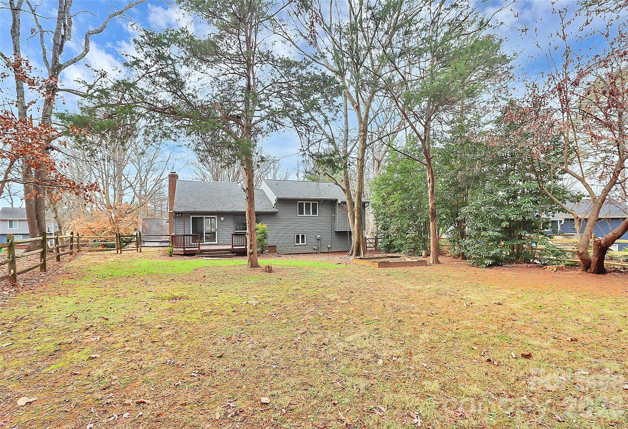 9421 Fairway Ridge Road Charlotte, NC 28277 - Photo 33 of 36 a house with trees in front of it
