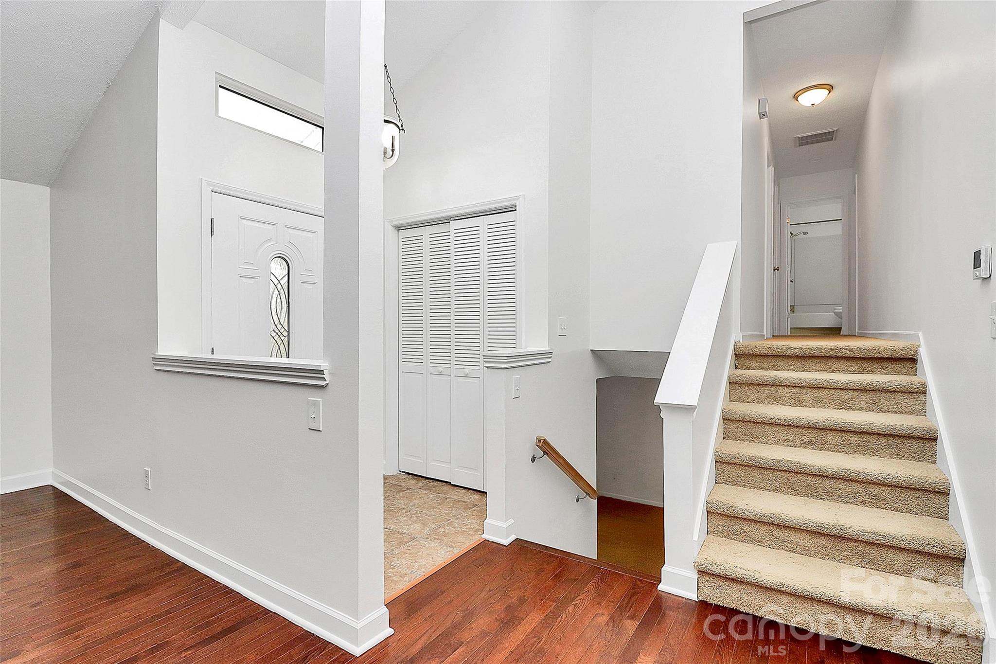9421 Fairway Ridge Road Charlotte, NC 28277 - Photo 4 of 36 a view of a hallway with wooden floor and entryway
