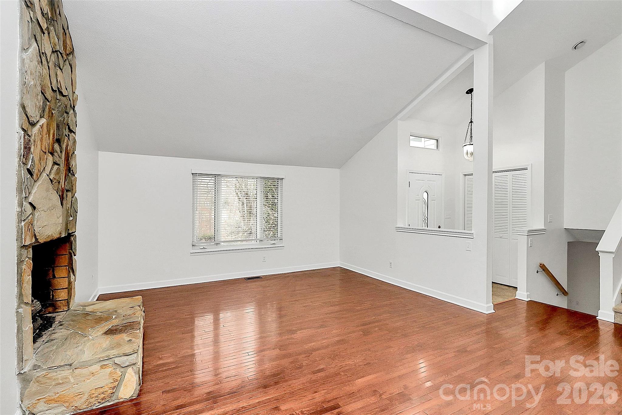 9421 Fairway Ridge Road Charlotte, NC 28277 - Photo 7 of 36 a view of empty room with wooden floor and fan