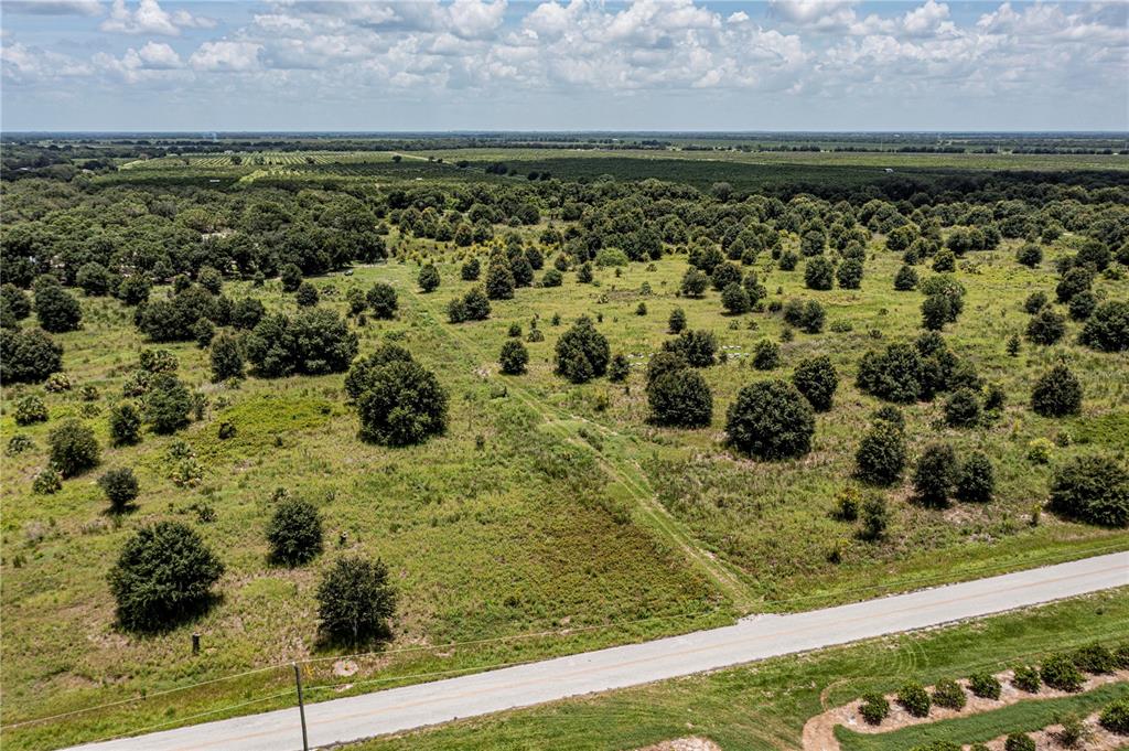 Southwest Hull Avenue Fort Ogden, FL 34267 - Photo 21 of 36 a view of a pathway both side of grassy field with shrub