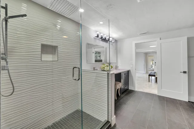 a view of a hallway with dining room and wooden floor