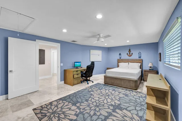 a bedroom with furniture and a window