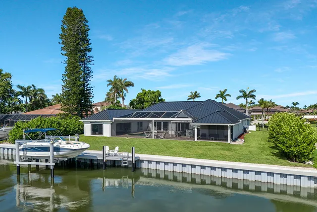 a front view of a house with a boat