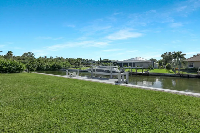a view of a lake with houses in the back