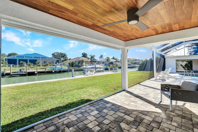 a view of swimming pool and outdoor seating