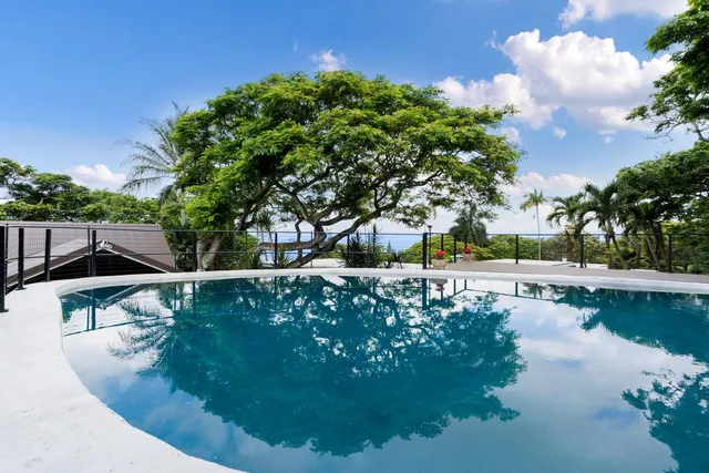 a view of a swimming pool with a patio